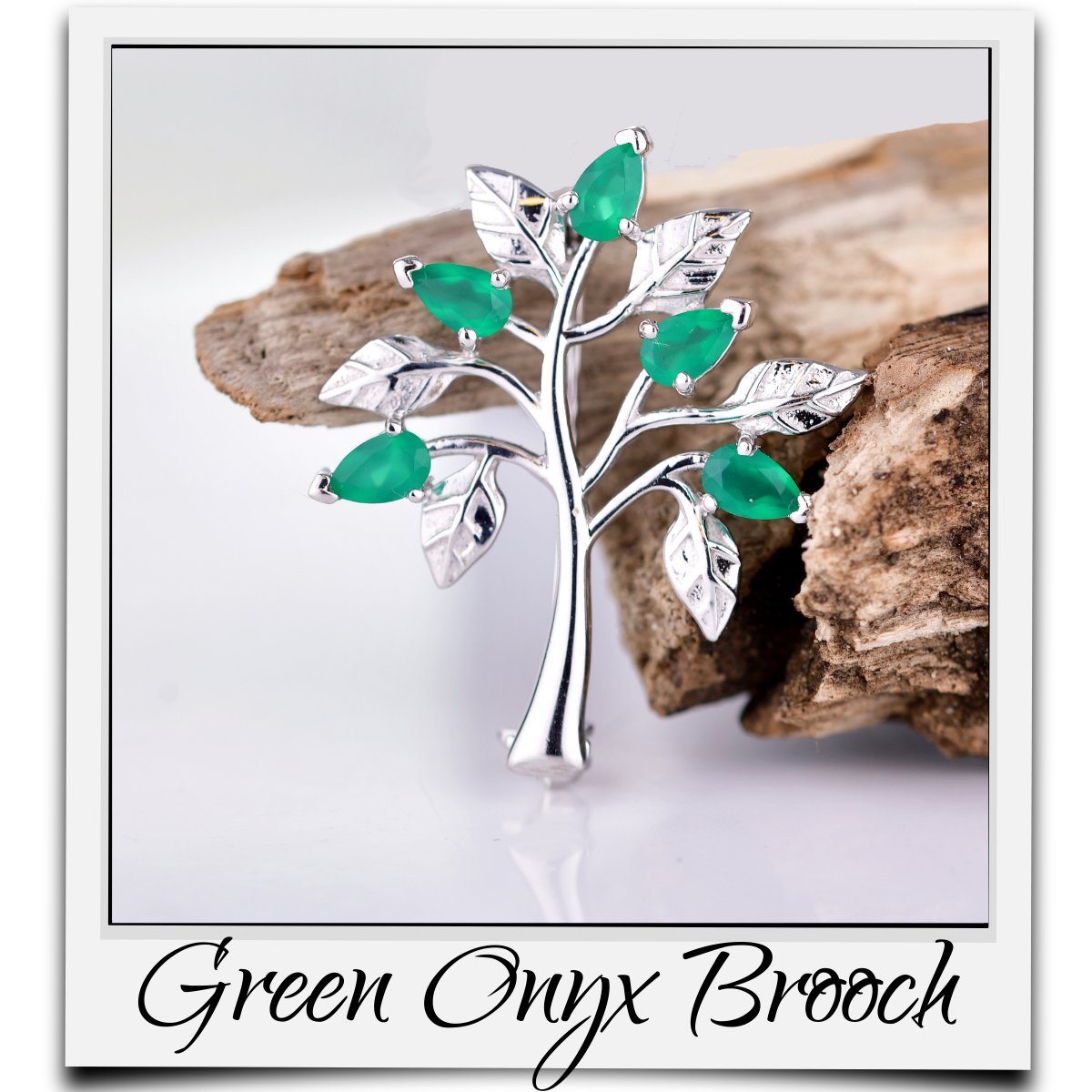 Natural green onyx tree of life brooch. Five pear faceted onyx stones set amongst leaves of equal size. Resting against a piece of wood. Set in an insta print photo frame