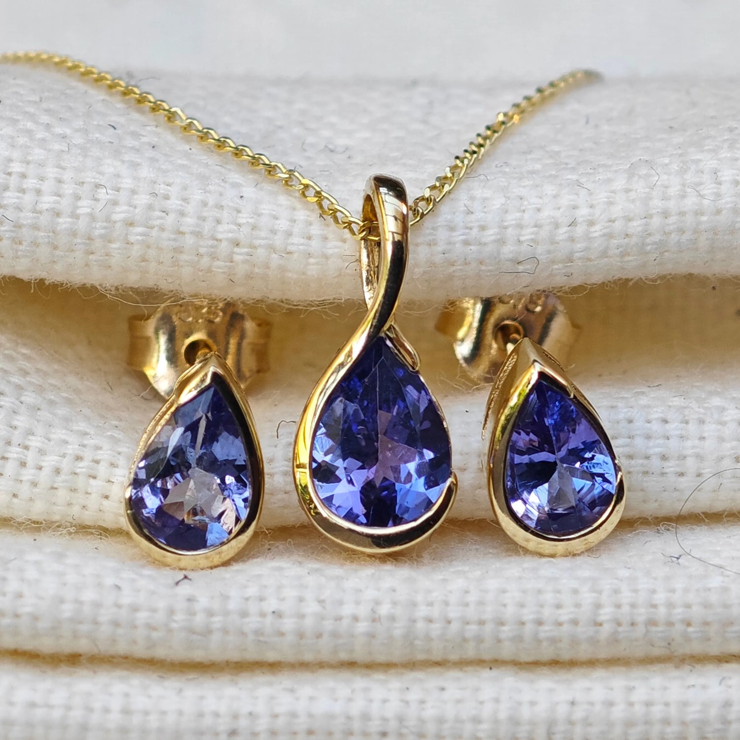 9ct Yellow Gold Tanzanite jewellery – necklaces, earrings – designed in the UK