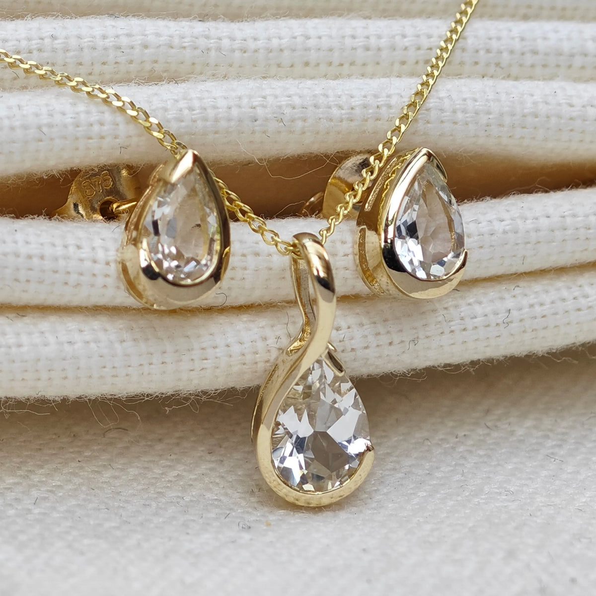 9ct Yellow Gold White Topaz jewellery – necklaces, rings, earrings – designed in the UK