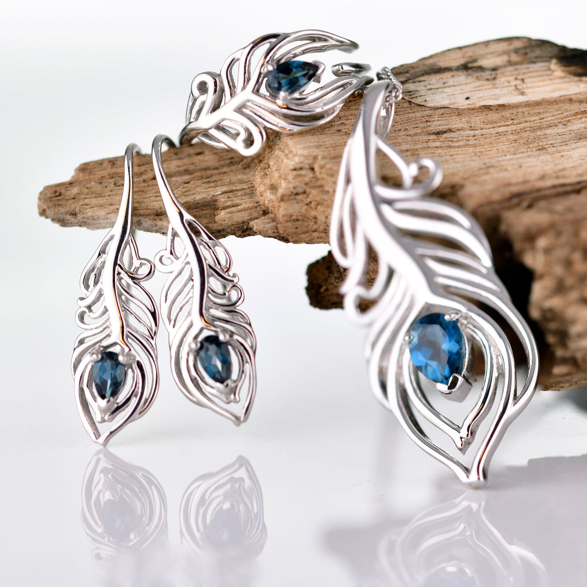 Natural London Blue Topaz Peacock Feather Set. Pear Topaz eye of feather, Set image included pendant on chain, dangle earrings, adjustable ring each set with a pear topaz as the feather eye