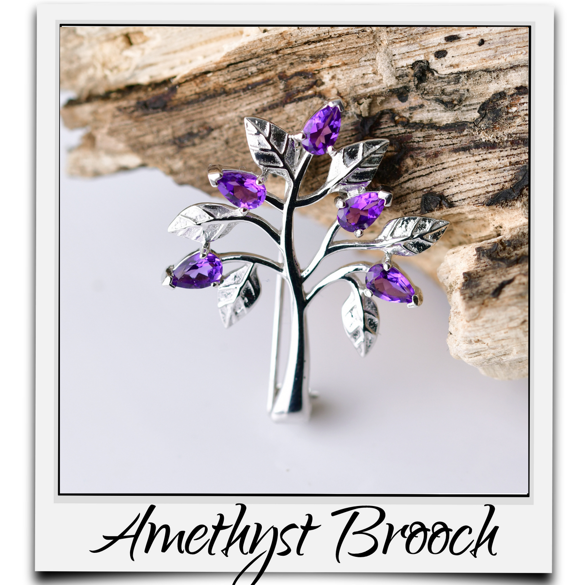 Amethyst tree of life brooch sterling silver resting on piece of wood