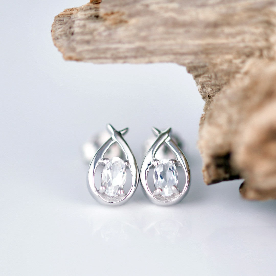 White Topaz Pear Twist Earrings in Sterling Silver