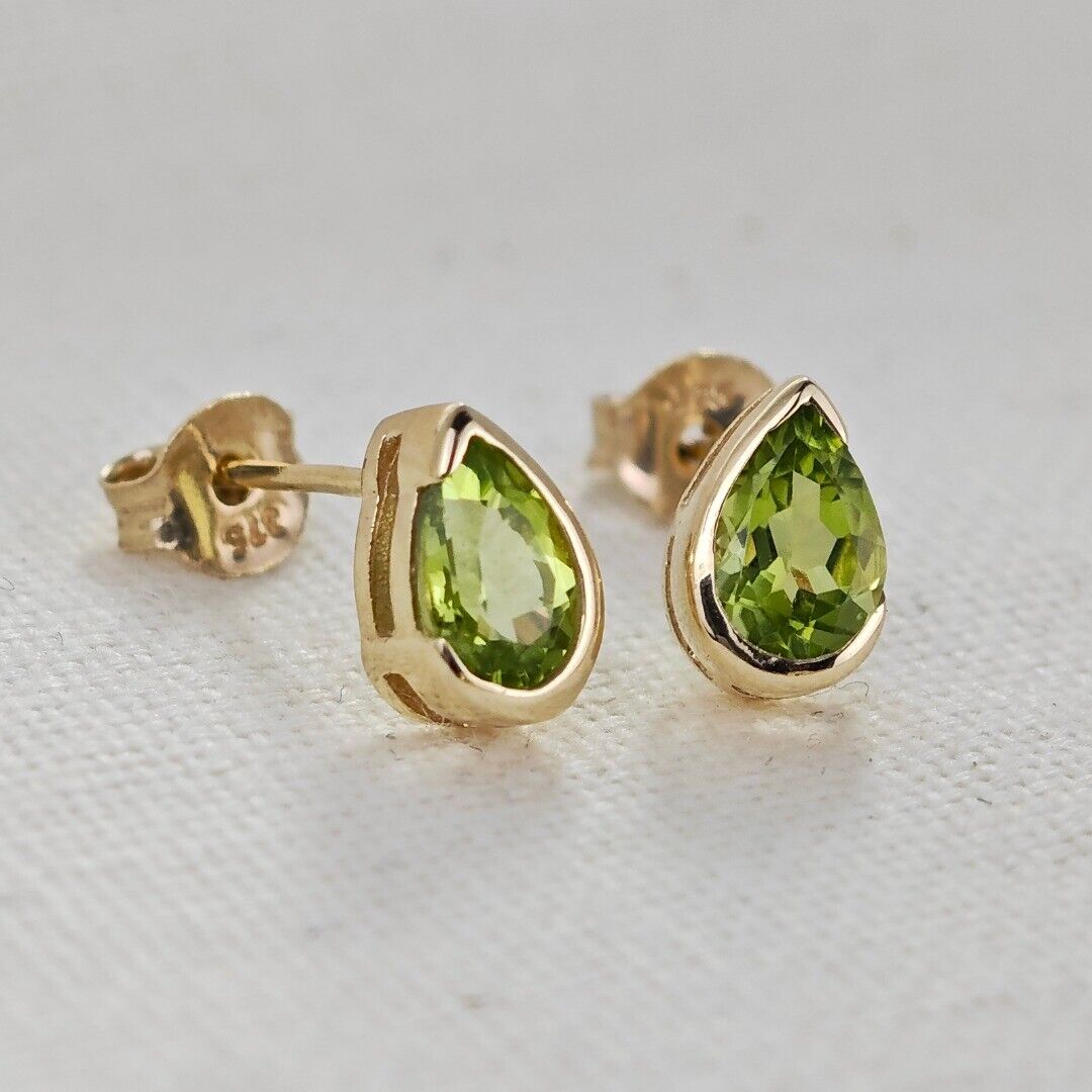 peridot gold stud earrings image 3