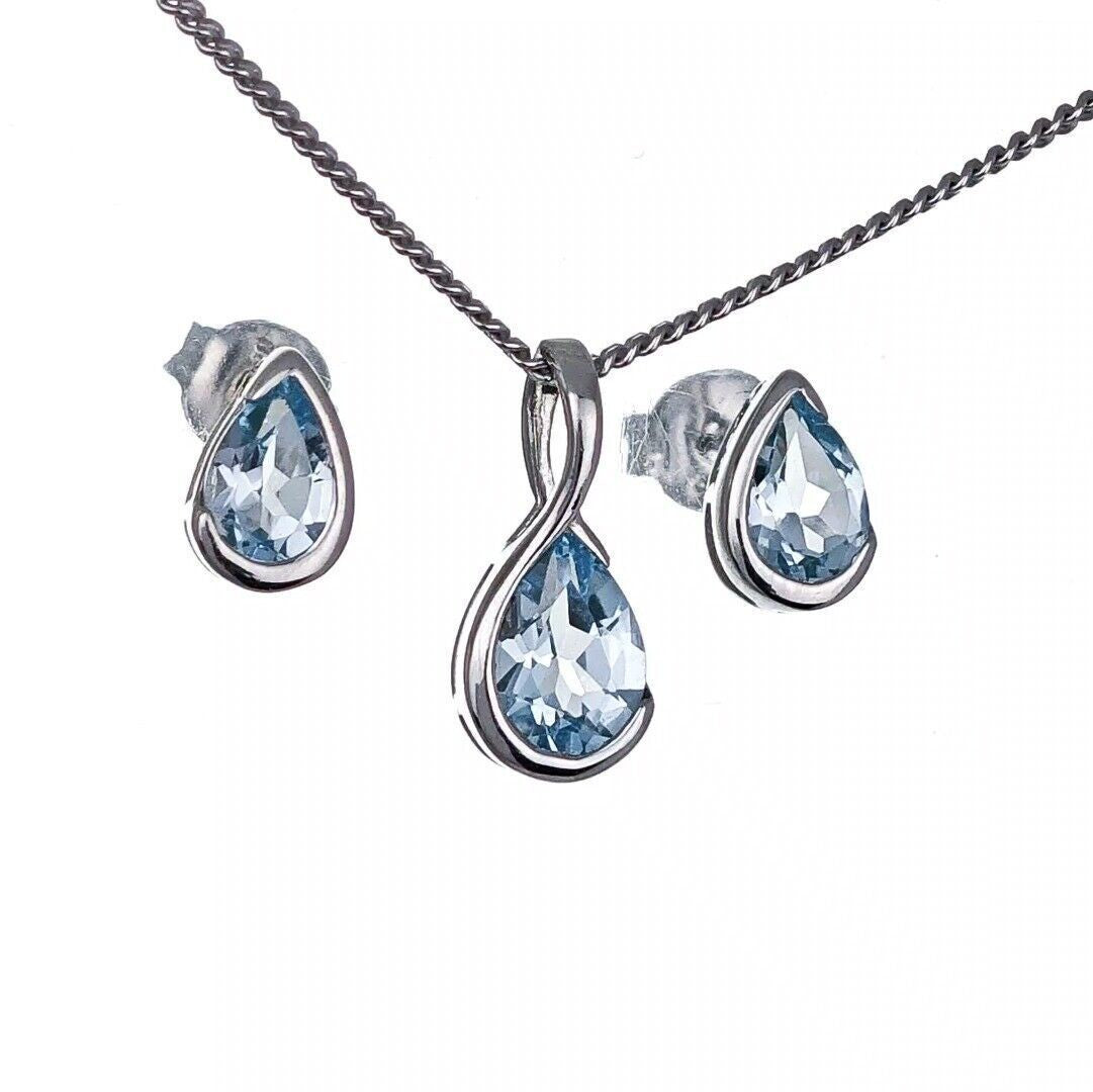 aquamarine necklace set sterling silver infinity loop pendant stud earrings designed in the UK