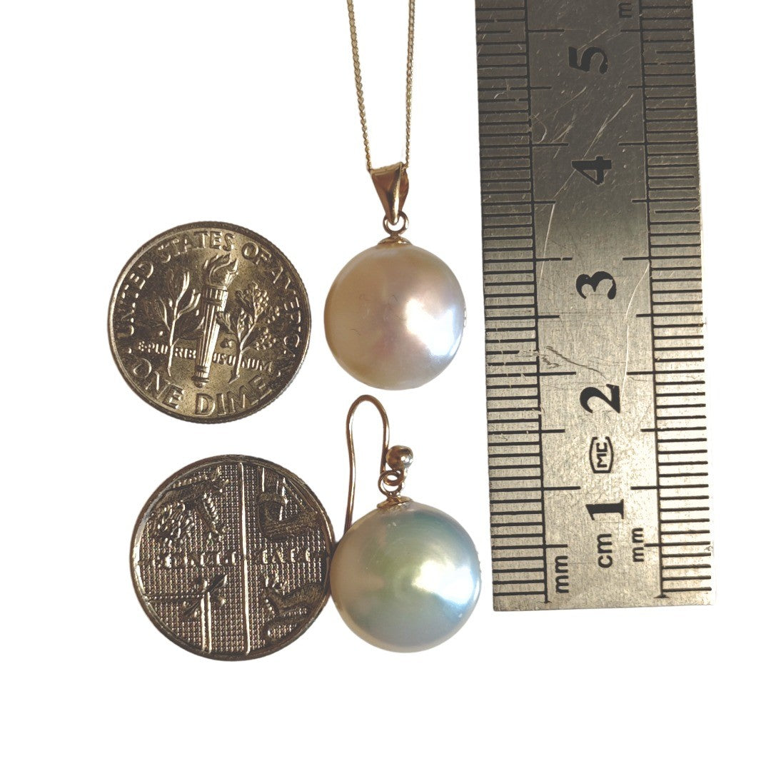 9ct gold disc pearl necklace on white background with matching earring shown against coins and a ruler for scale