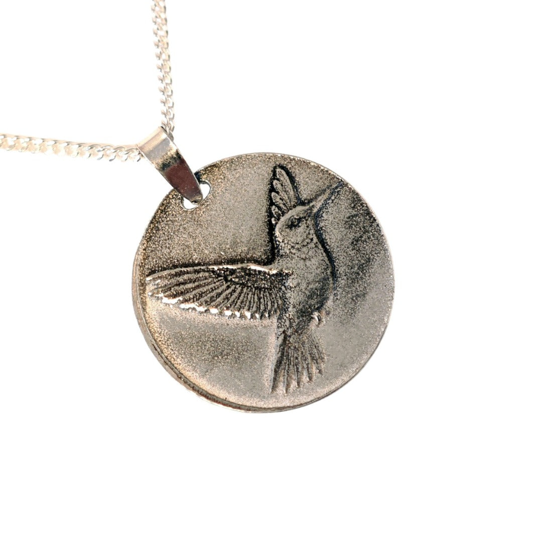 Hummingbird deep engraved sterling silver pendant on curb chain