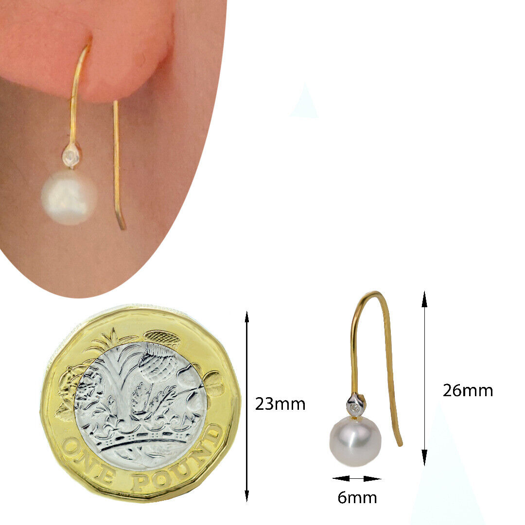 Pearl earrings with gold hooks and small diamonds on white background against coin and shown on ear