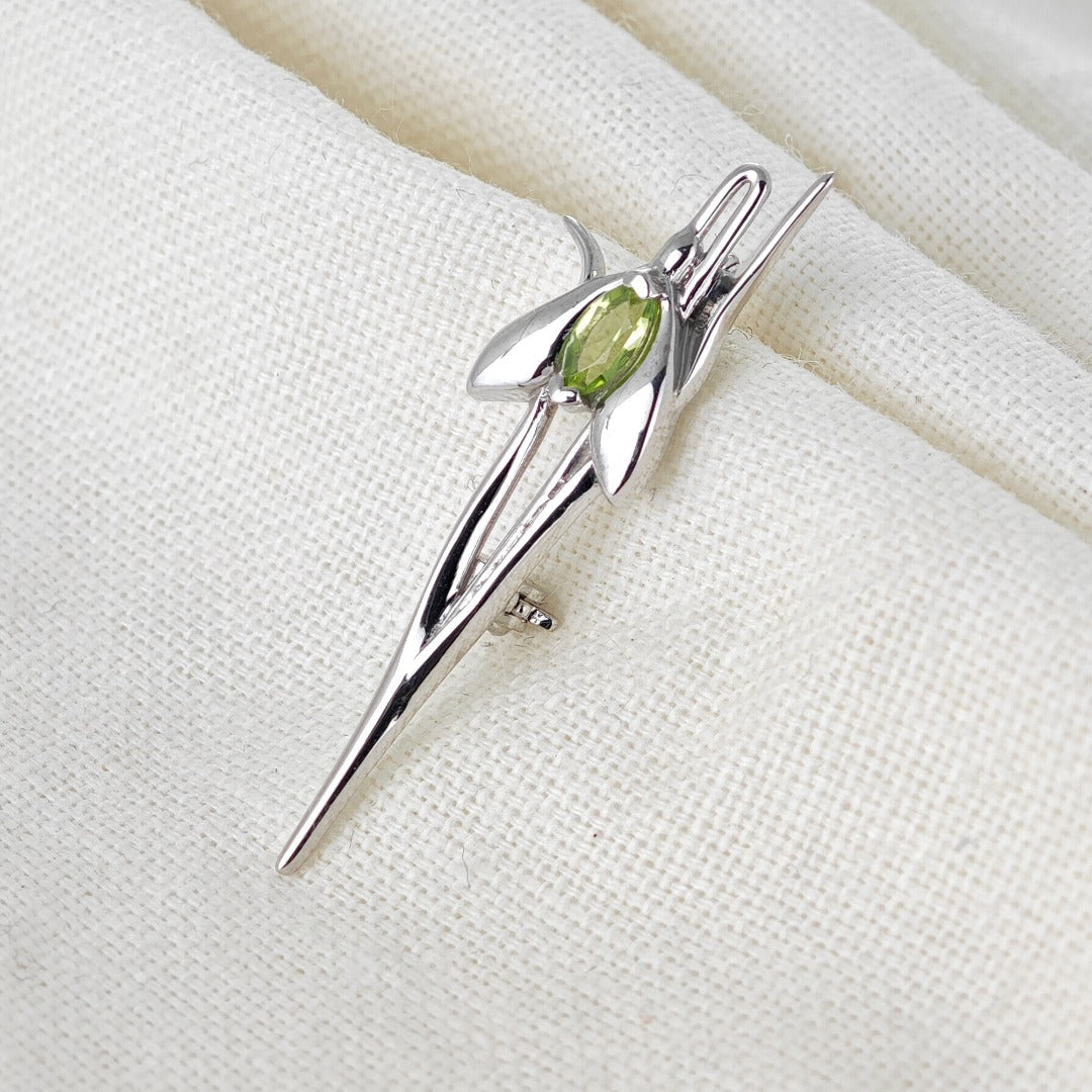 Peridot Snowdrop Brooch Sterling Silver on cotton