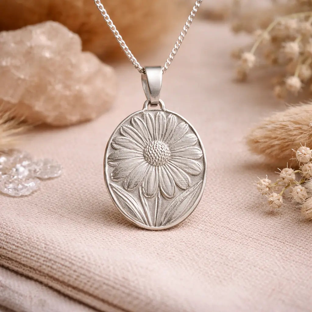 sterling silver daisy pendant on natural backdrop