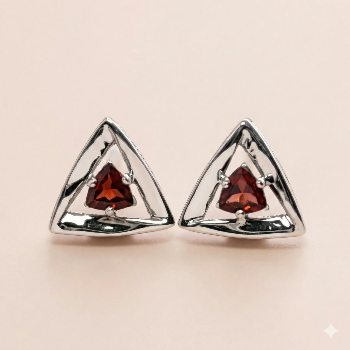 Sterling silver triangle trillion earrings set with red garnet