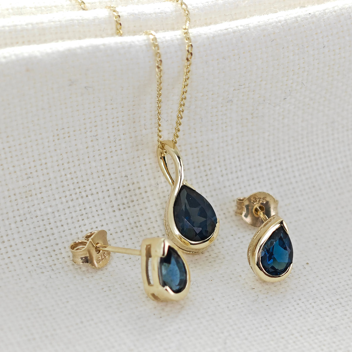 9ct Yellow Gold Blue Topaz jewellery – necklaces, rings, earrings – designed in the UK