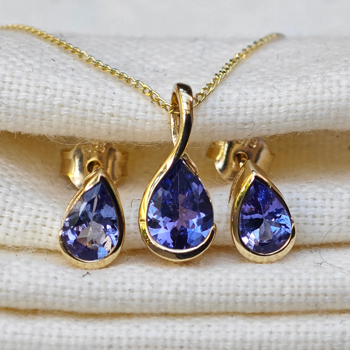 9ct Yellow Gold Tanzanite jewellery – necklaces, earrings – designed in the UK