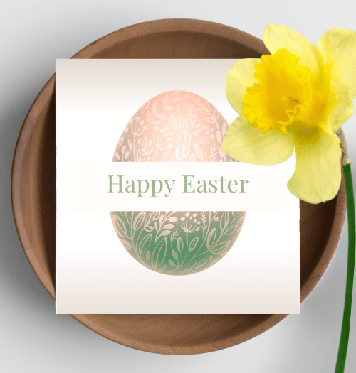 Easter card with decorative eggs and a yellow flower on a wooden plate.