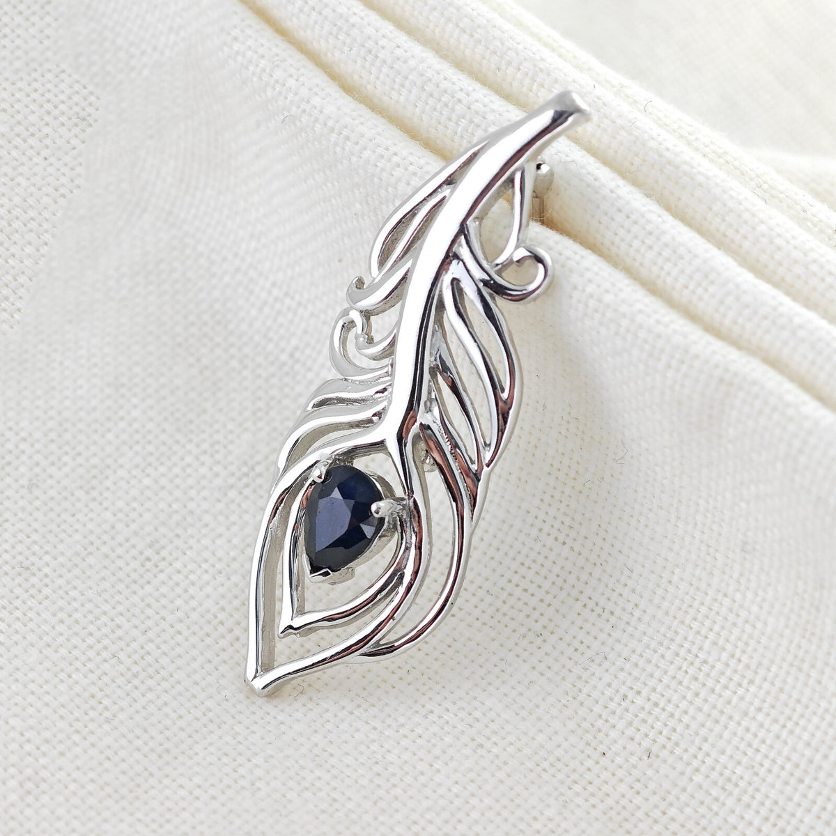 sapphire sterling silver brooch peacock feather inky blue gift boxed designed in the UK