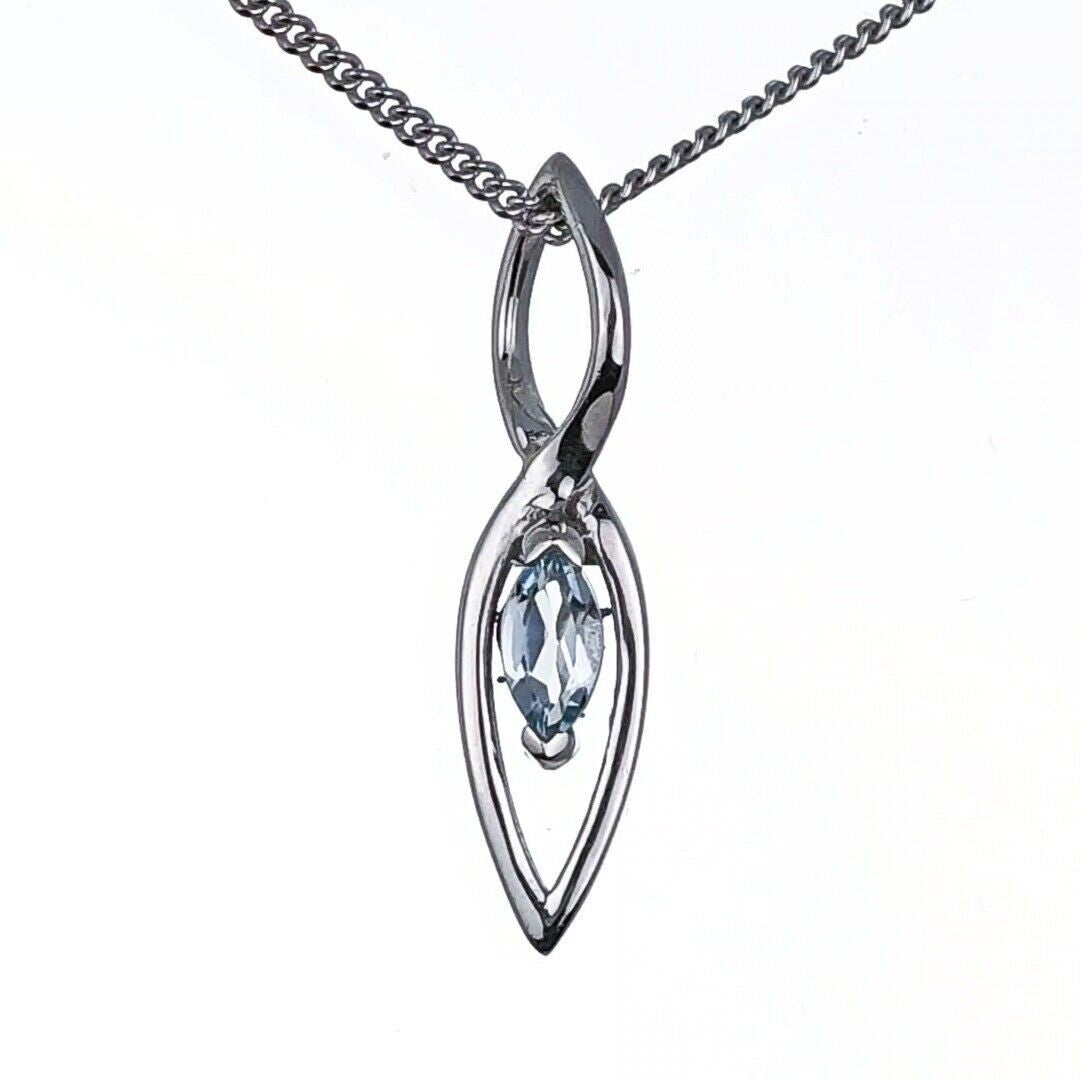 blue topaz pendant sterling silver marquise infinity loop designed in the UK