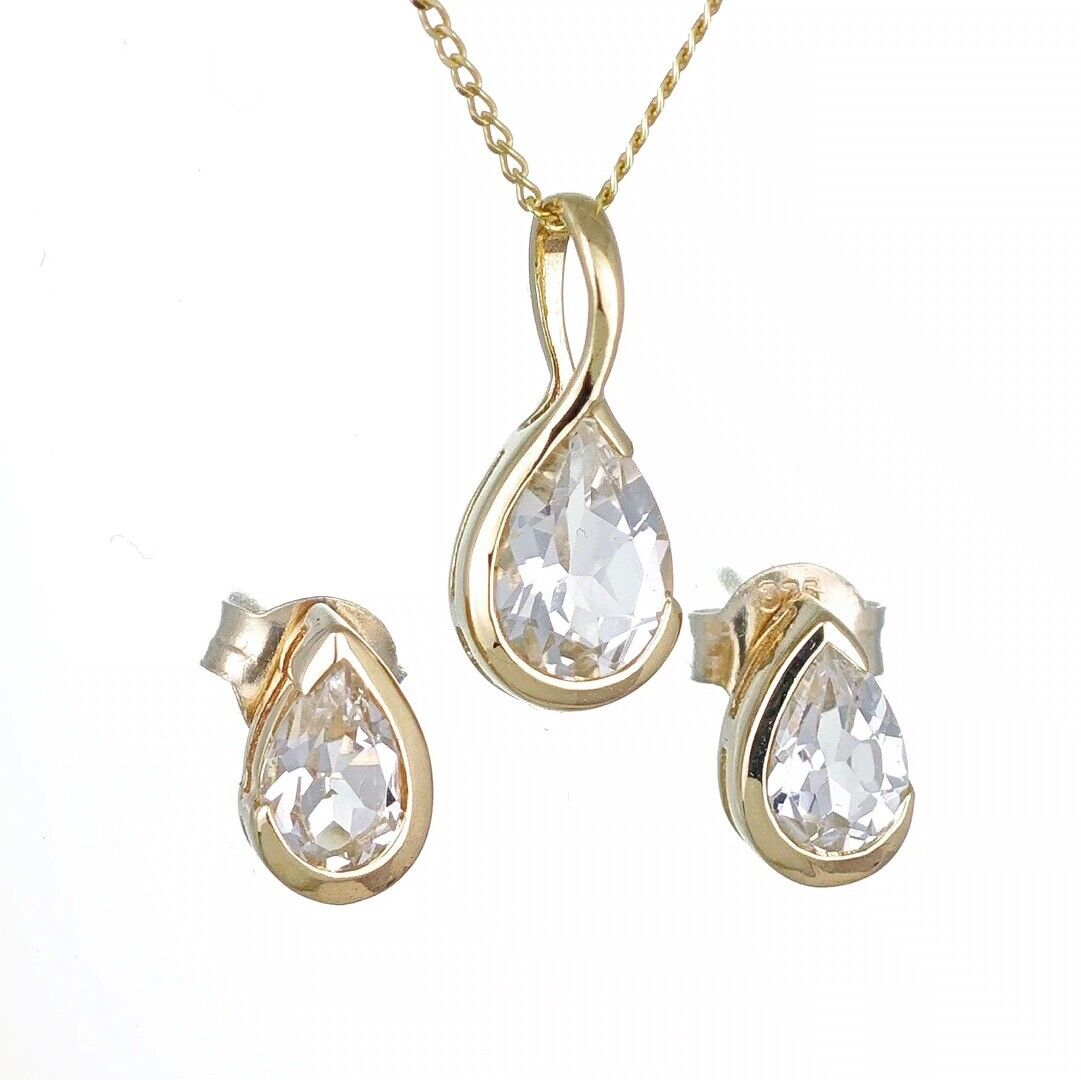 white topaz set pendant and earrings 9ct yellow gold infinity loop designed in the UK