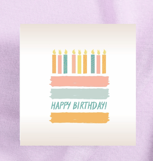 Birthday card with colorful candles and 'Happy Birthday!' text on a light purple background
