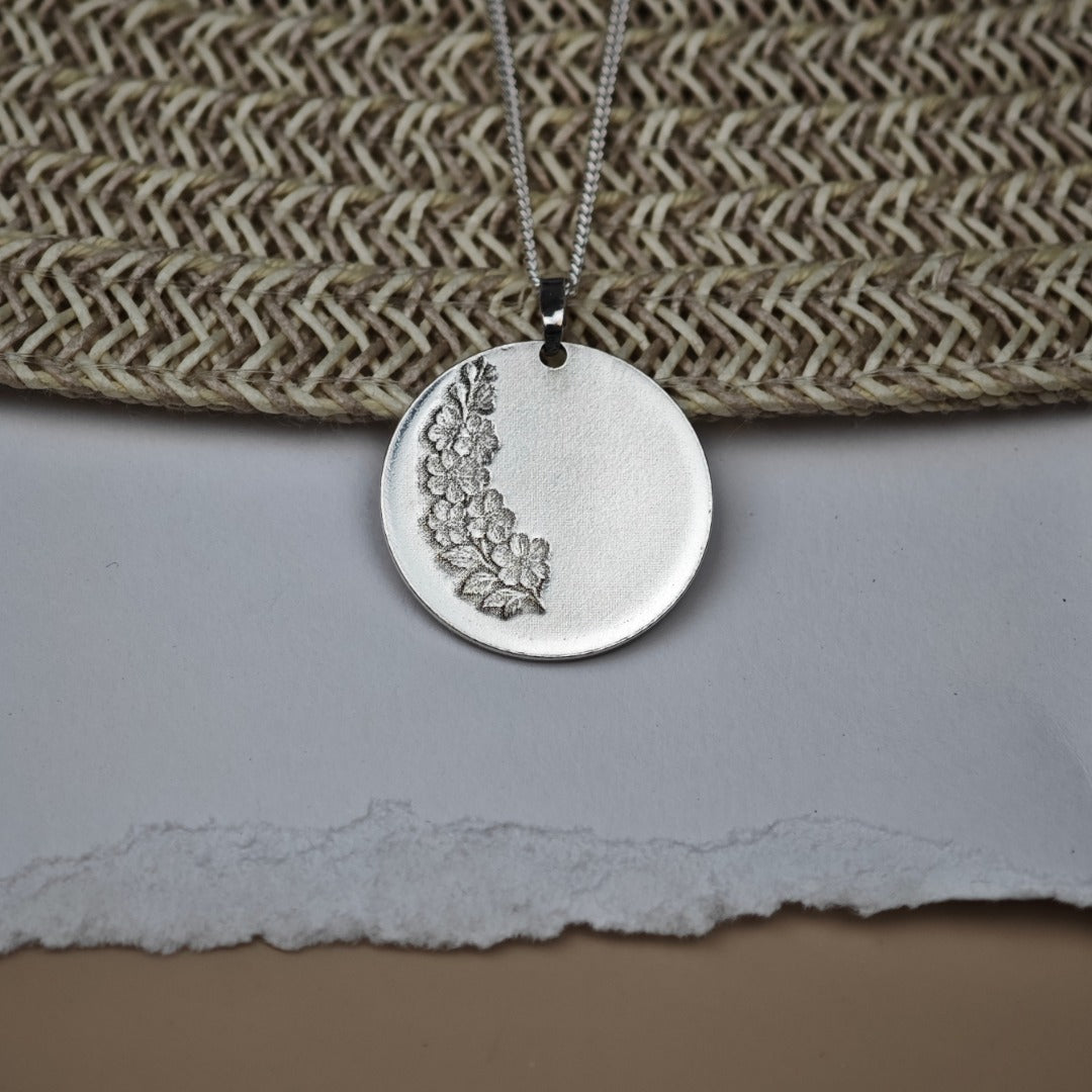 Larkspur Birth Flower Coin Necklace in Sterling Silver