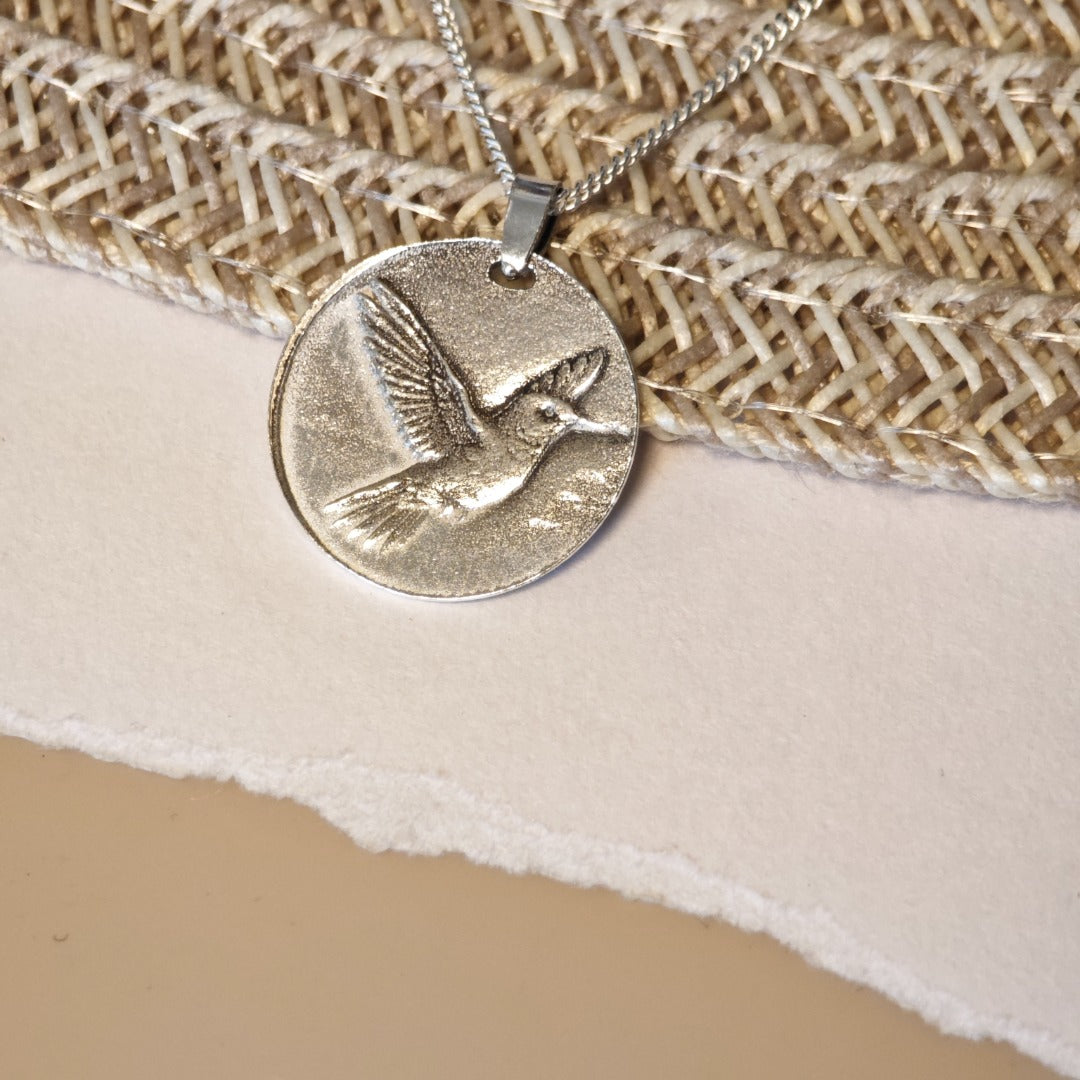Hummingbird deep engraved sterling silver pendant on curb chain