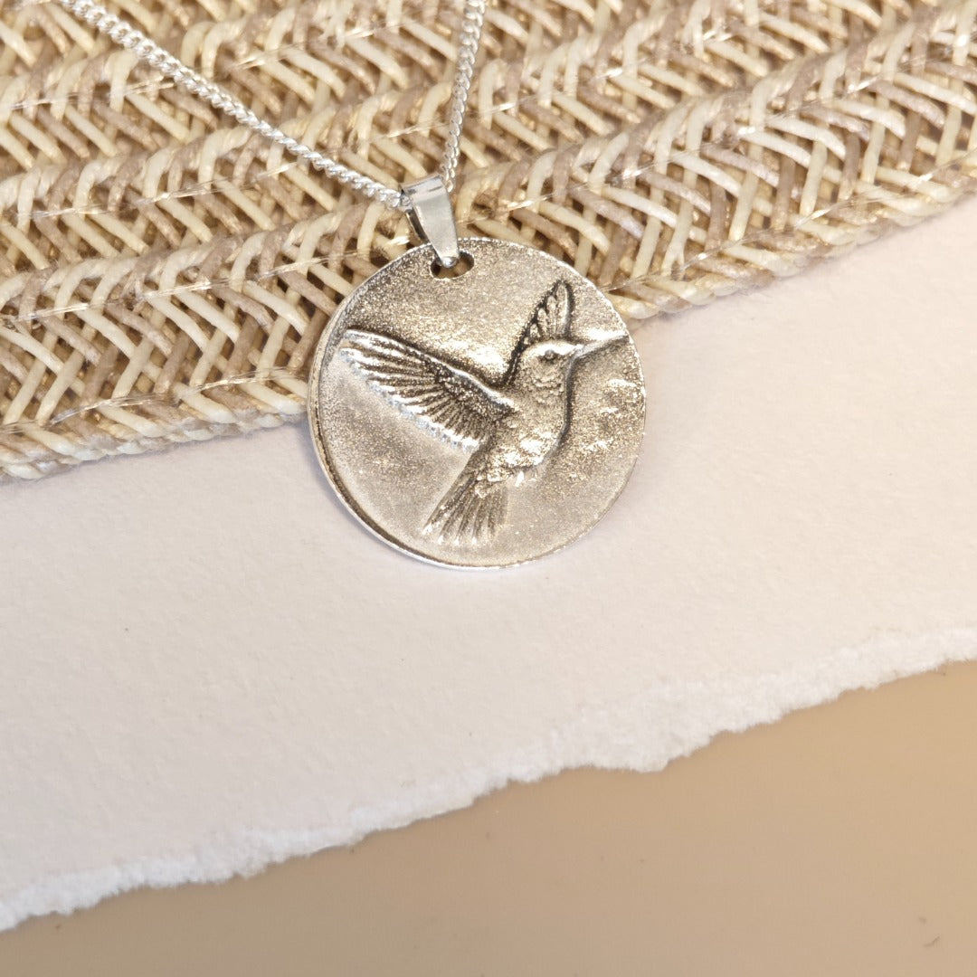 Hummingbird deep engraved sterling silver pendant on curb chain
