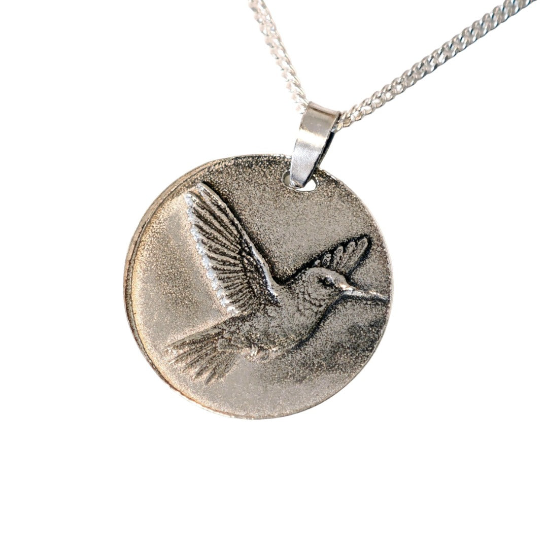 Hummingbird deep engraved sterling silver pendant on curb chain