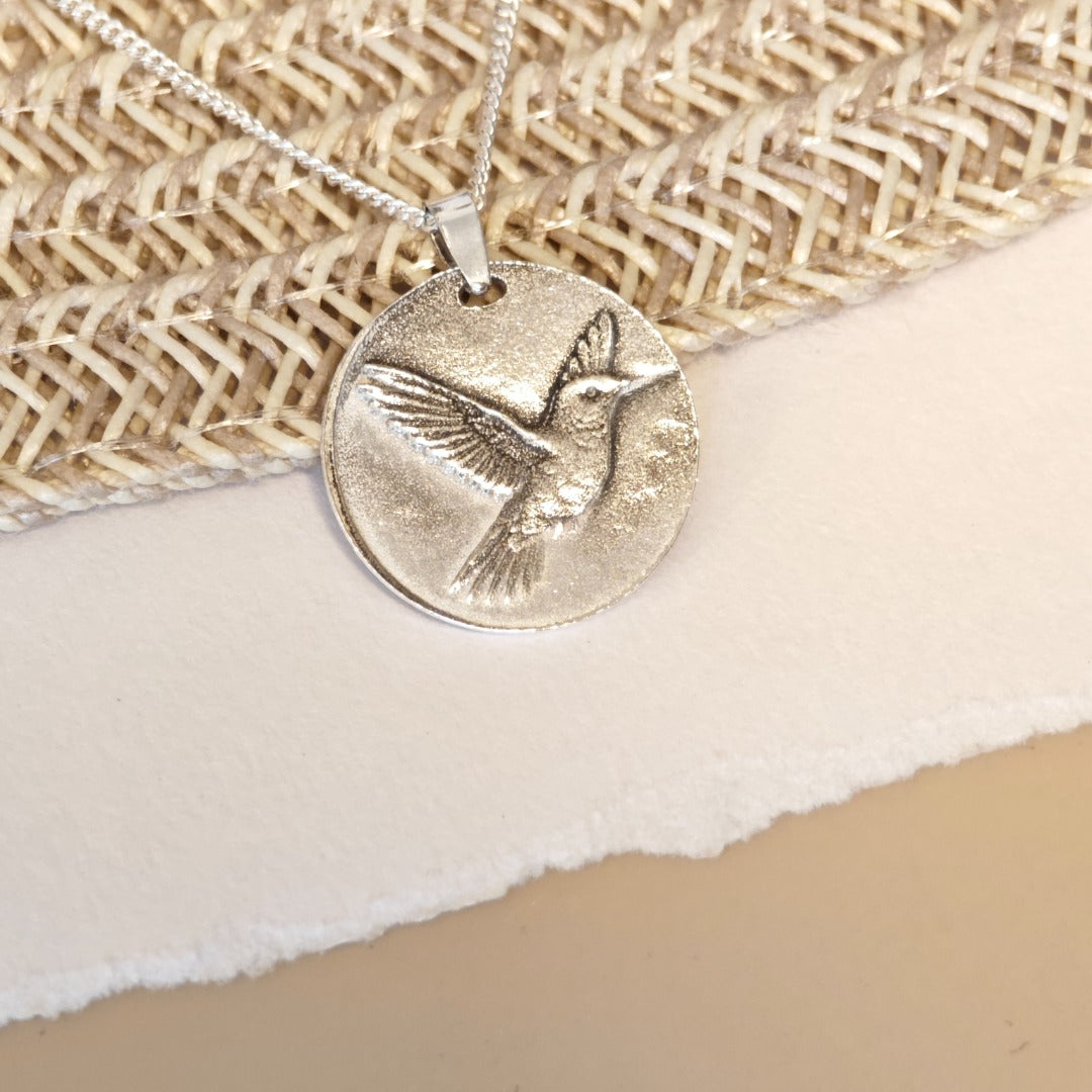 Hummingbird deep engraved sterling silver pendant on curb chain