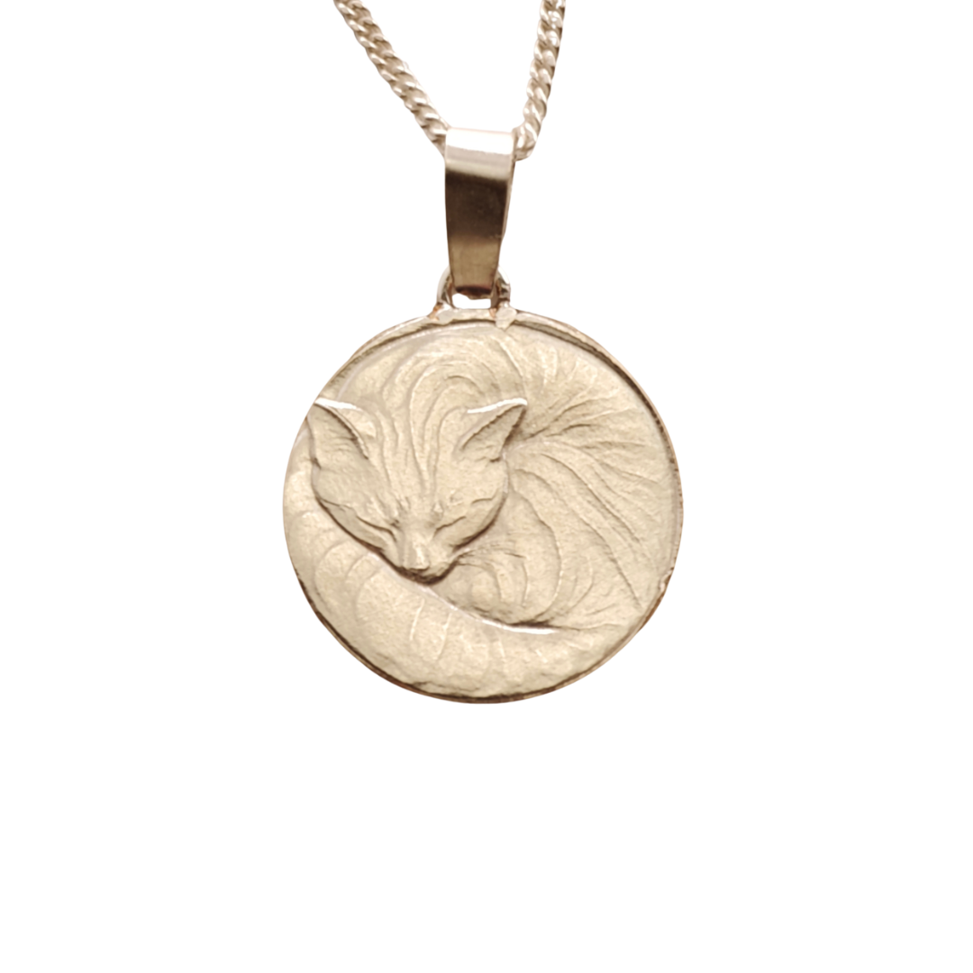 Curled cat pendant in sterling silver