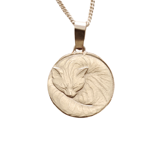Curled cat pendant in sterling silver