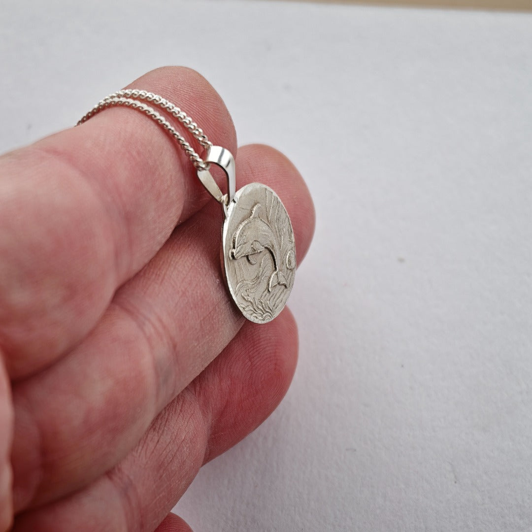 Dolphin Engraved Sterling Silver Coin Necklace