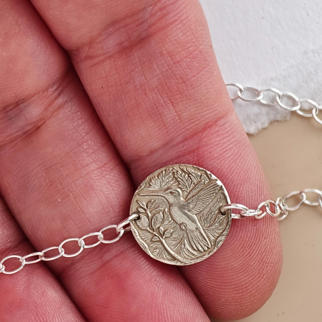 Hummingbird coin bracelet - engraving detail