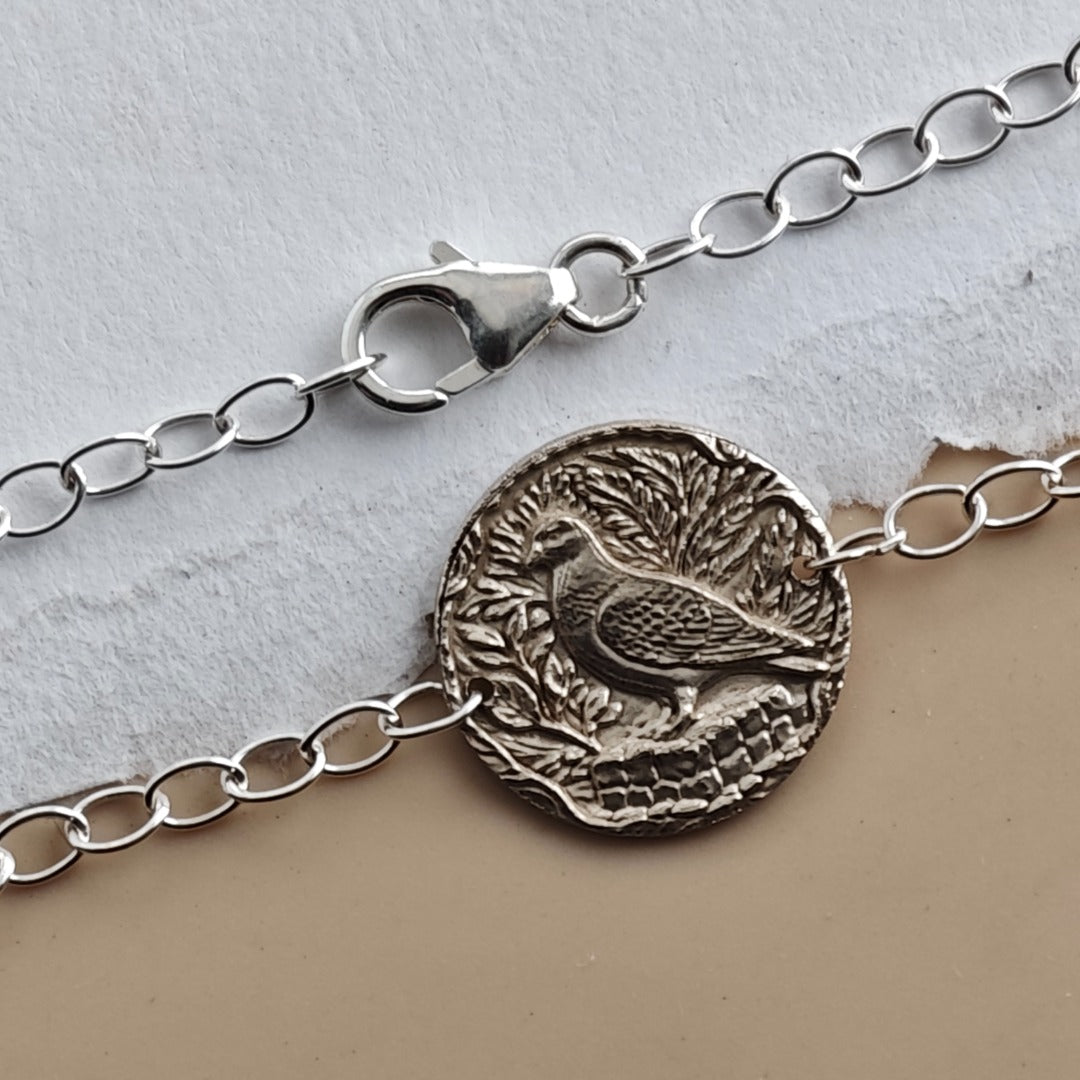 Pigeon coin bracelet - alternate angle