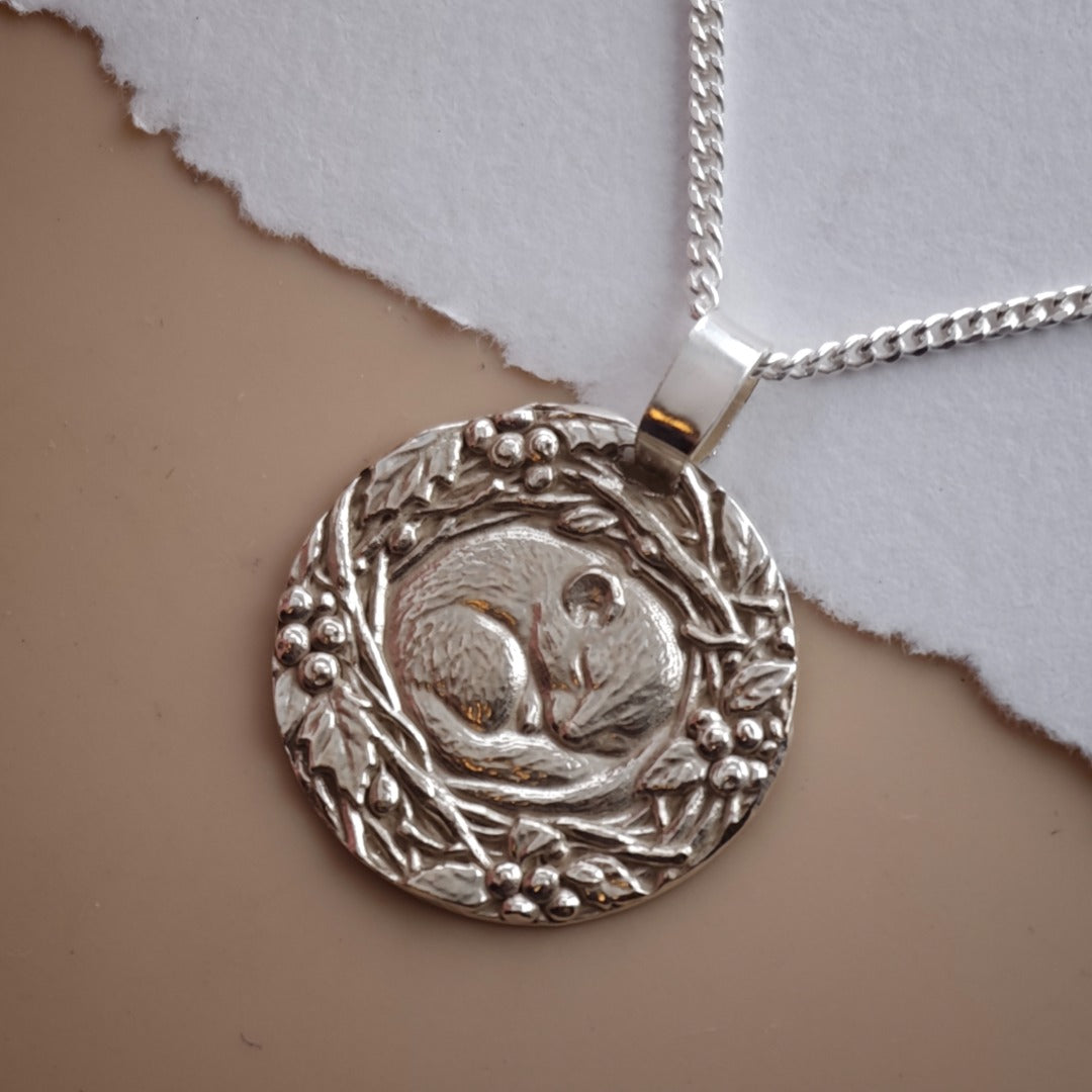 Dormouse curled in a winter nest engraved coin pendant necklace in recycled sterling silver, Ojewellery Christmas jewellery