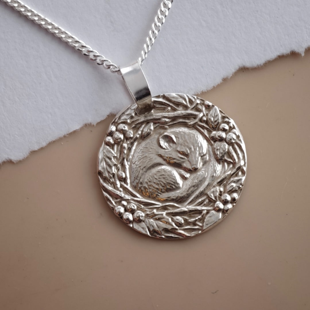 Dormouse curled in a winter nest engraved coin pendant necklace in recycled sterling silver, Ojewellery Christmas jewellery