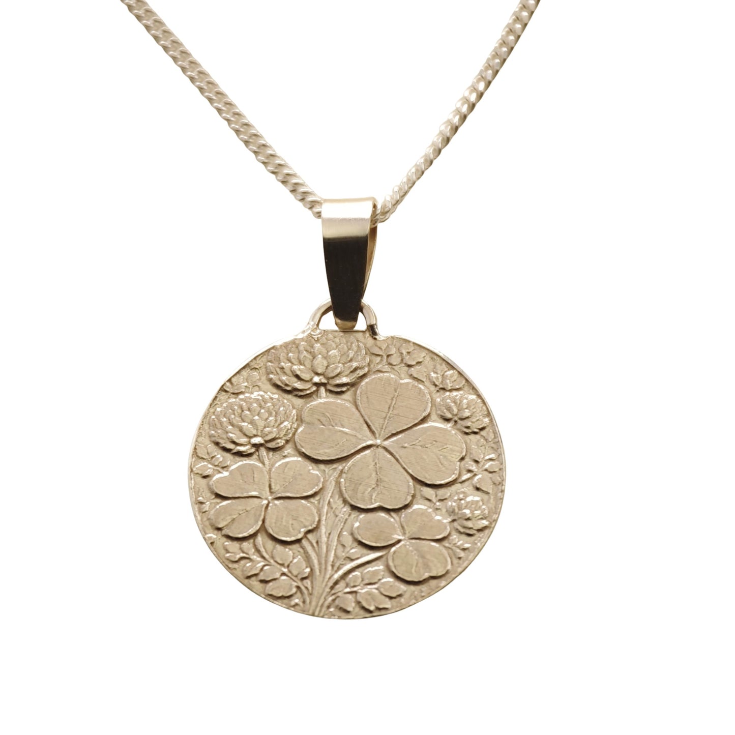 silver necklace with a four leaf clovers and clover flowers pendant on a white background