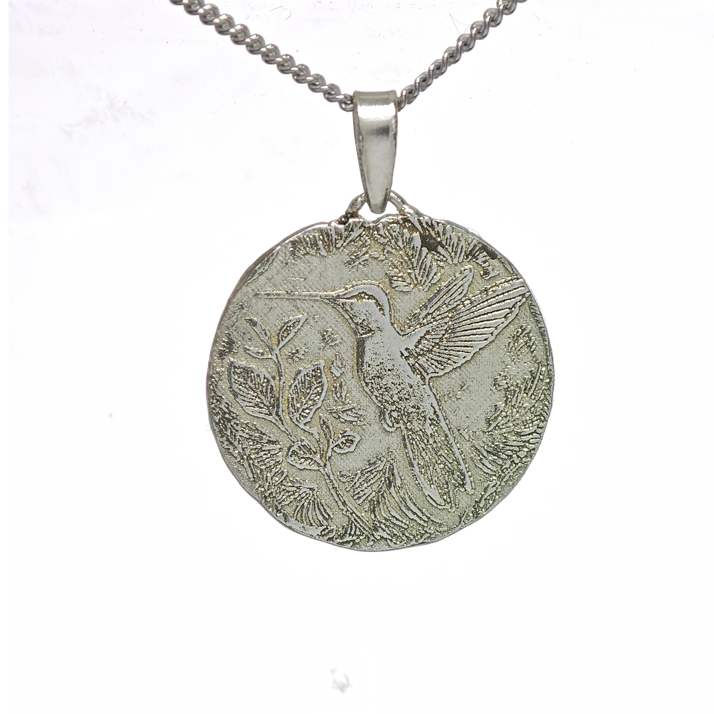 Silver pendant with bird design on a white background