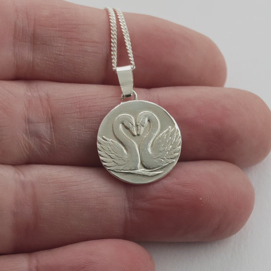 Gemini Sterling Silver Necklace Zodiac Twin Swans Disc Pendant on hand moving