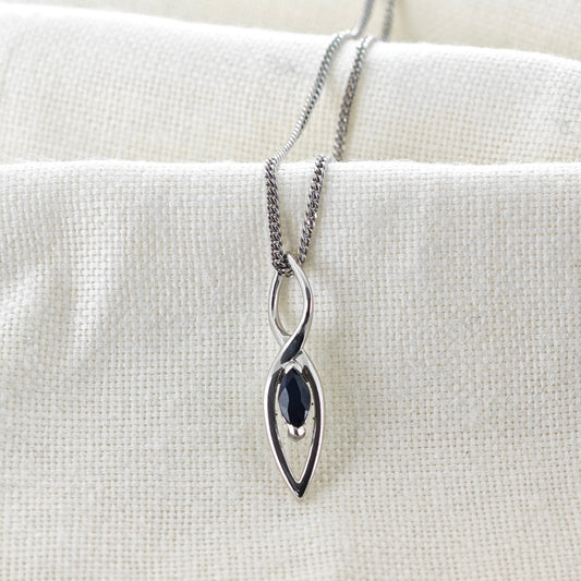 Australian Inky Blue Natural Sapphire  Pendant made of Sterling Silver on cotton cloth